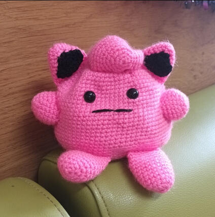 A crocheted plush of the pokemon Jigglypuff
