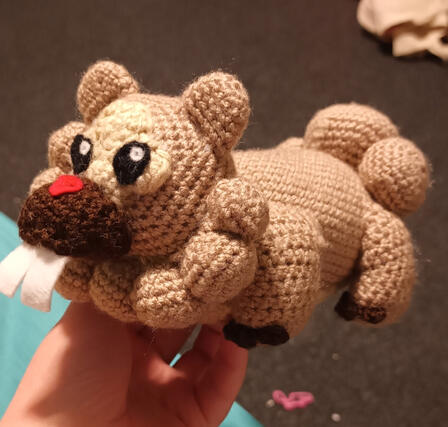 A crocheted plushie of the pokemon Bidoof
